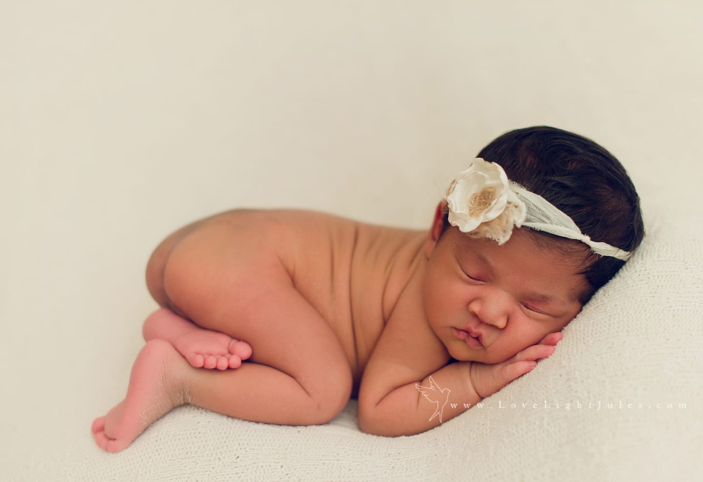 image-of-newborn-photo-session-on-cream-background-by-sacramento-photographer
