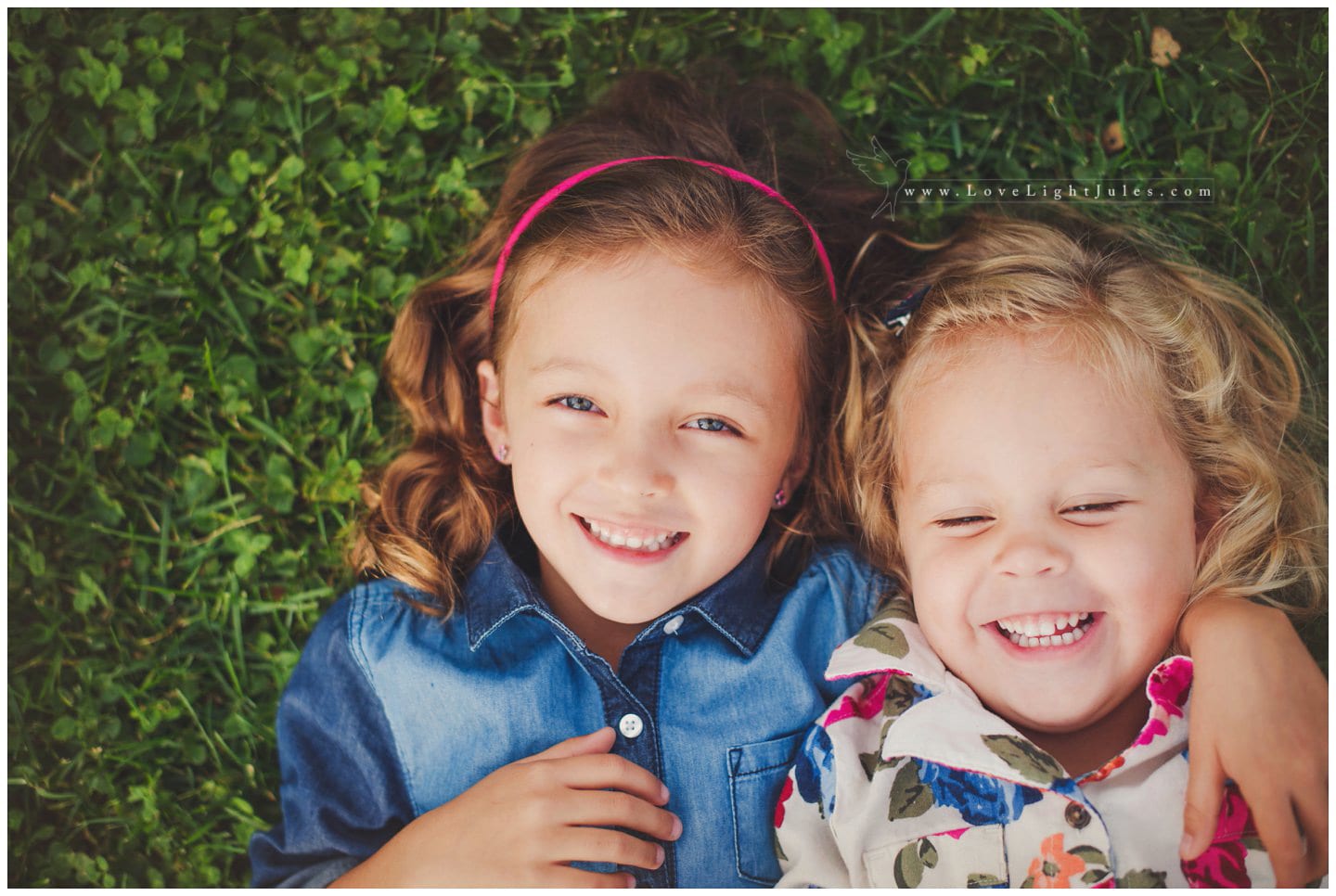 image-of-children-sisters-laying-in-bed-of-grass