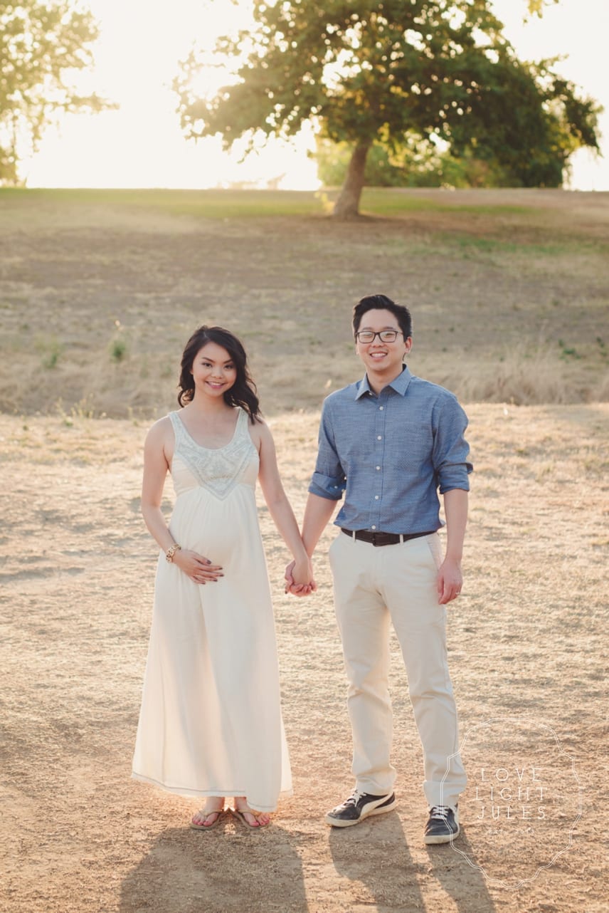 Vertical-shot-of-maternity-couples-shoot-at-gibson-ranch-during-sunset