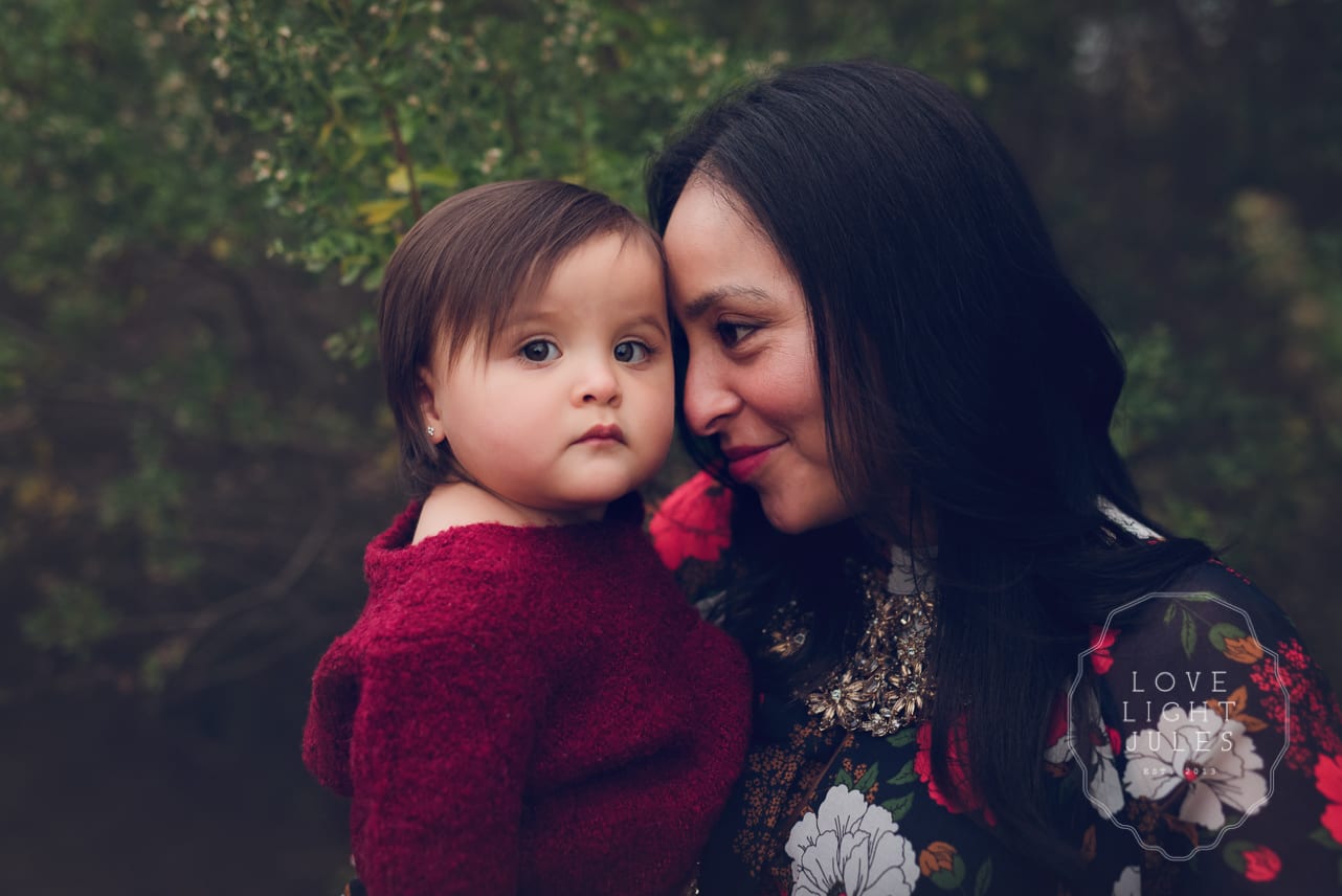 mom-and-baby-snuggles-for-outdoor-fall-photo-session-in-natomas-location