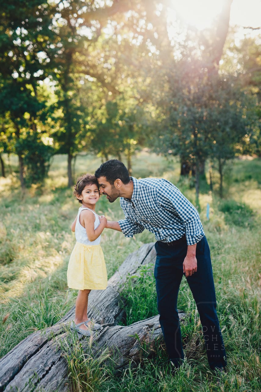 Father-and-dad-in-field-for-family-photos-at-effie-yeaw-in-sacramento