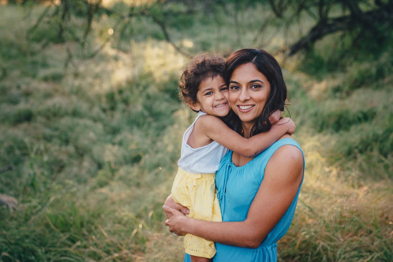 Mom-and-daughter-being-photographed-in-meadows-at-sacramento-nature-reserve