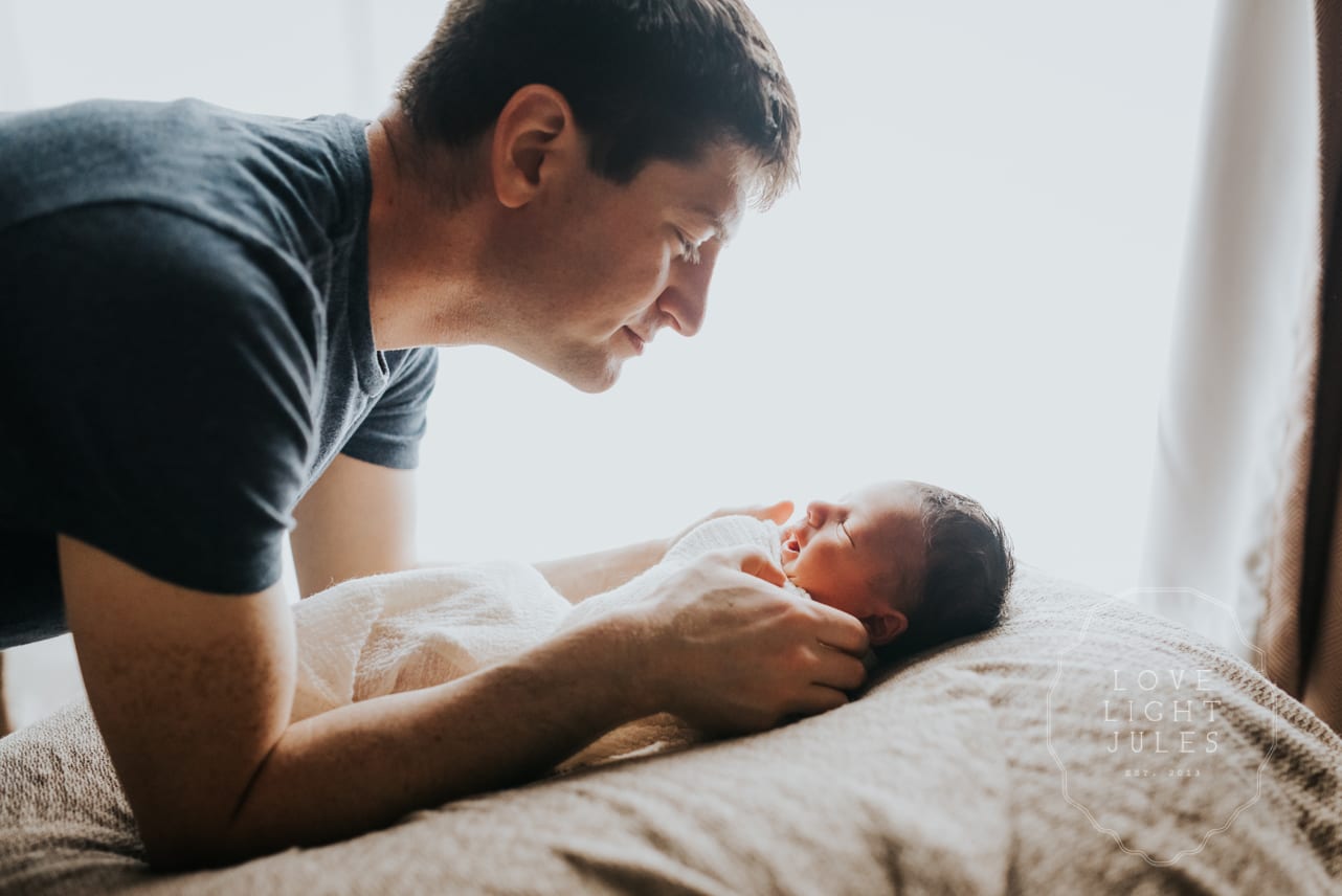 backlit-newborn-portrait-with-dad-in-sacramento