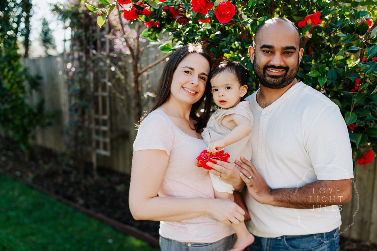 family-of-three-with-flowers-in-sacramento-home