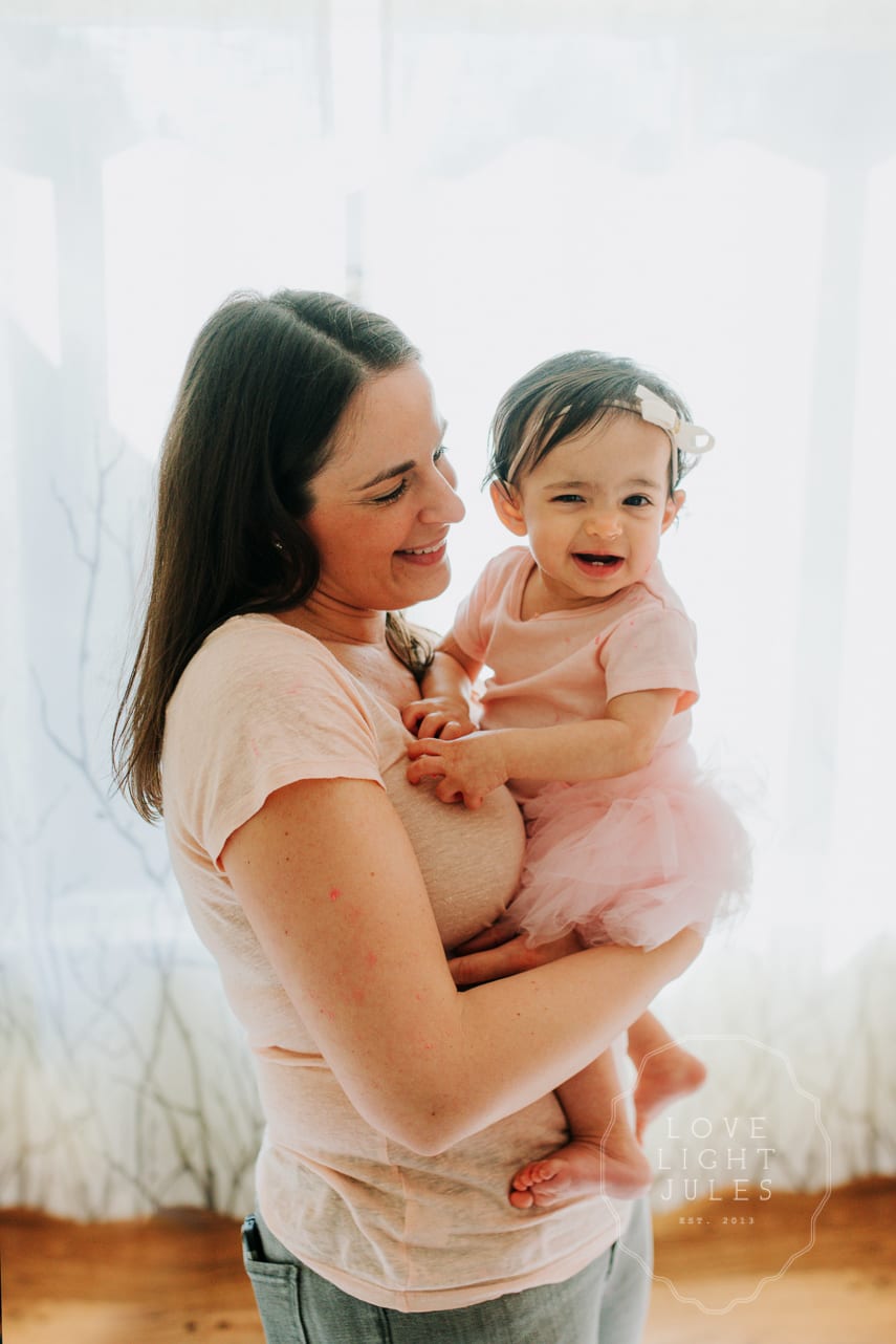 backlit-photograph-of-mom-and-baby-daughter-in-sacrament-home