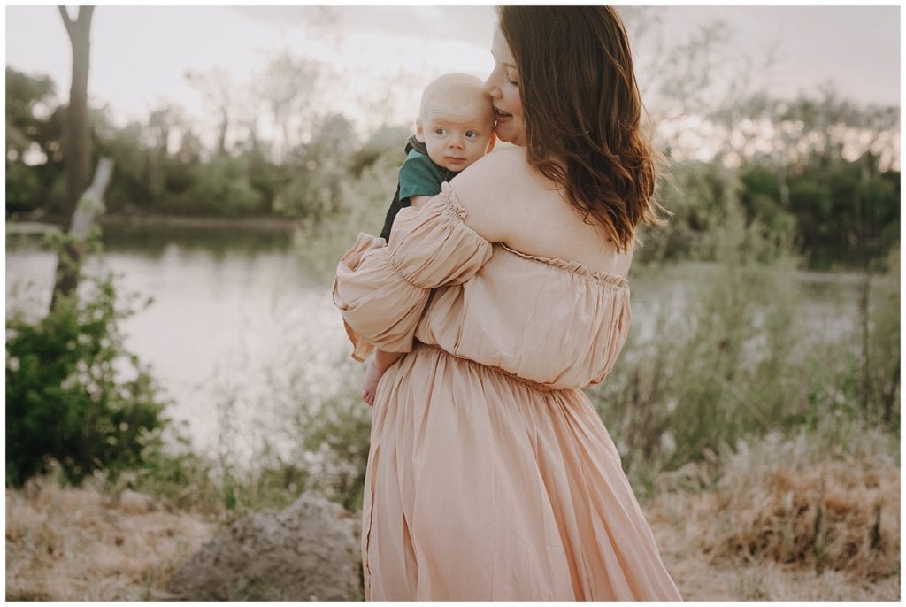 image-of-mom-and-newborn-baby-son-posing-by-sacramento-river