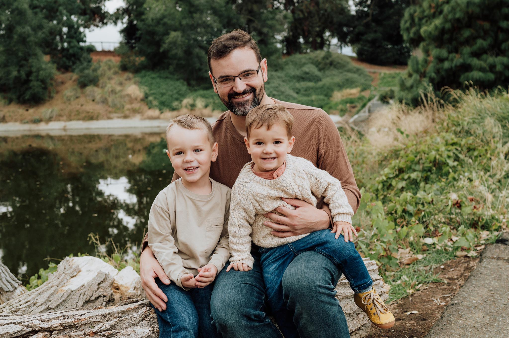 Photograph of father and boys during fall photo shoot at UC Davis campus